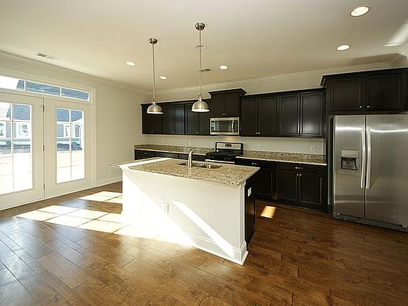 Photos are of a similar home