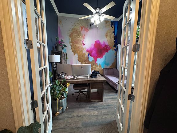 Office with french doors off entrance to house