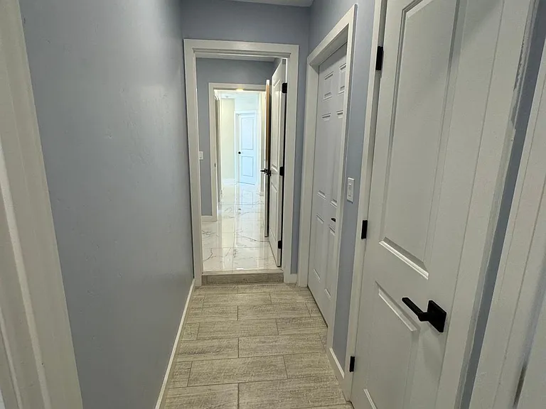 Hallway from master suite in the front into the main house.