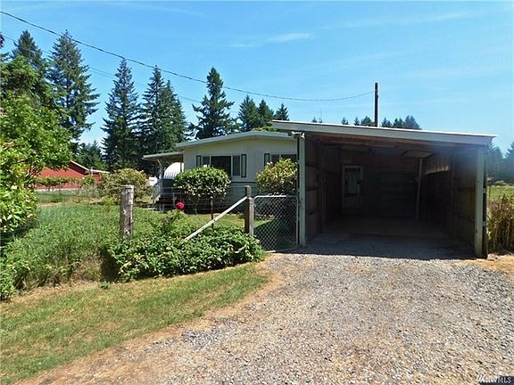 The carport has a really unique door hidden inside