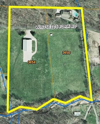 Aerial view of house, pasture and barn