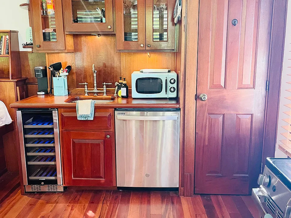Full kitchen with microwave, dishwasher, wine fridge, stove/oven and full size fridge