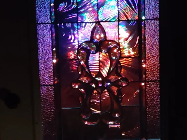 Leaded glass entry door allows lights to shine. Many lighting changes during days and nights. Faces south.