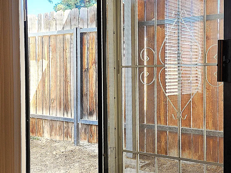 Master Bedroom Patio Door to Covered Patio and Yard Area