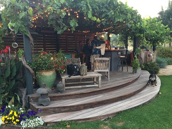 Outdoor Kitchen/Wet Bar with seating area for entertaining