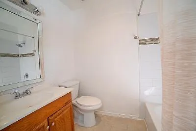 APT 33 - BATHROOM - Most of the Bathrooms look like this with varied vanities and mirrors.