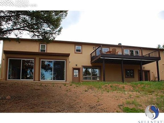 Back of the house with sun room and new deck