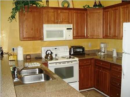 Kitchen with granite counter tops and crown molding