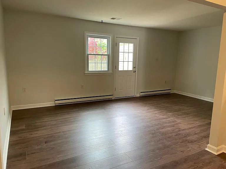 Living room with door towards the backyard