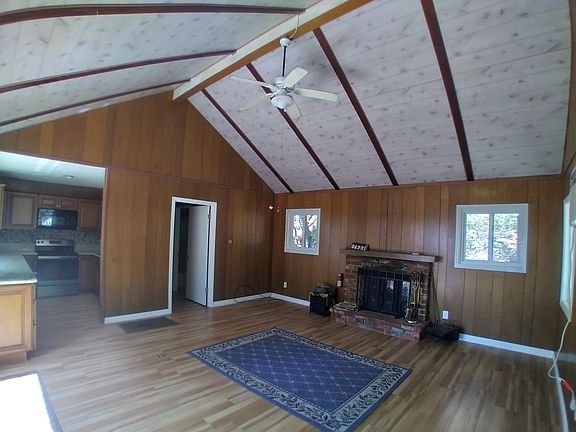 Living and Dining area with wood burning fireplace
