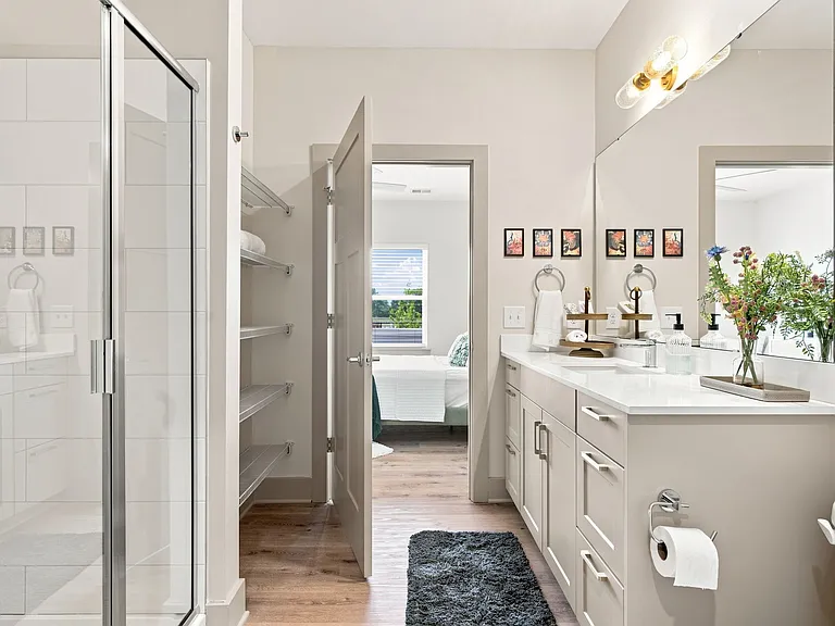 Thoughtfully designed, the A1 bathroom offers a large vanity, walk-in shower, abundant storage, and a spacious walk-in closet_everything you need to make your daily routine feel effortless.