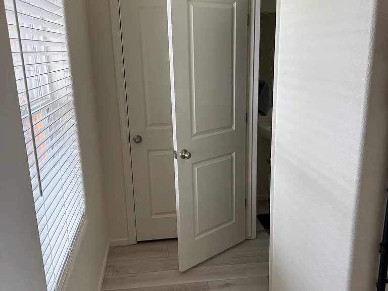Coat closet and half bath on lower level