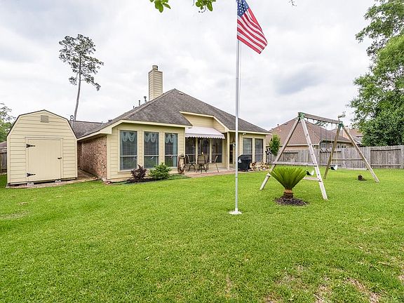 The storage shed is neatly tucked to the side of the house and can be reached from the garage.
