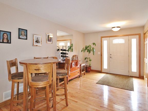 Gleaming oak wood floors greet you as you enter the front door. The family room is just beyond and flows into the kitchen creating a wonderful space for entertaining. The wood floors extend throughout the whole living area. Double door foyer closet keeps coats and shoes out of the way. 