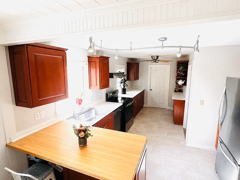 Bright, open kitchen. Door at the end leads to master bedroom/ bathroom.