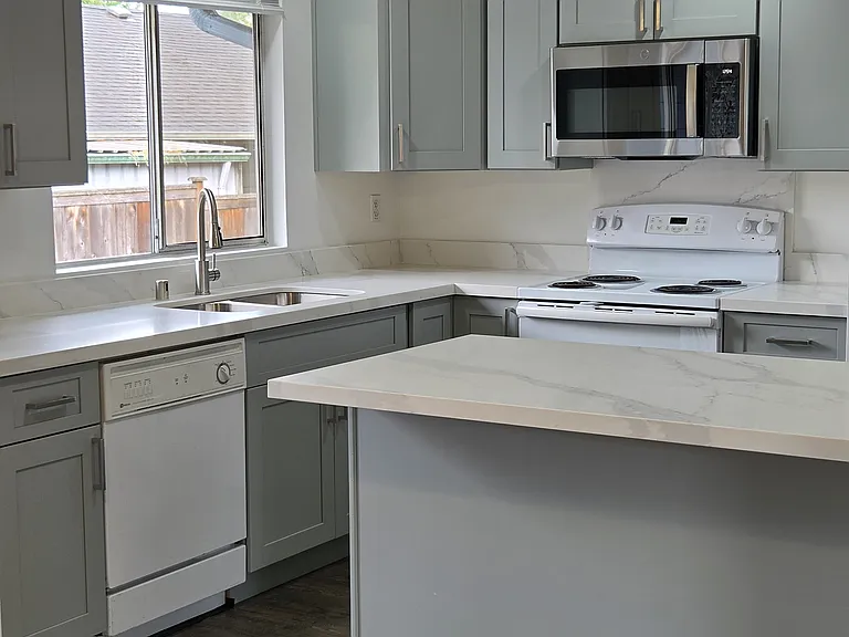 Kitchen with new microwave, cabinets, countertops