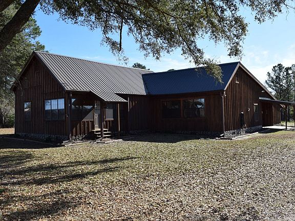 Custom 2388 sq. ft. wood cabin with metal roof 