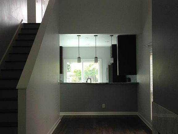 High ceilings and breakfast bar highlight the open floor pla