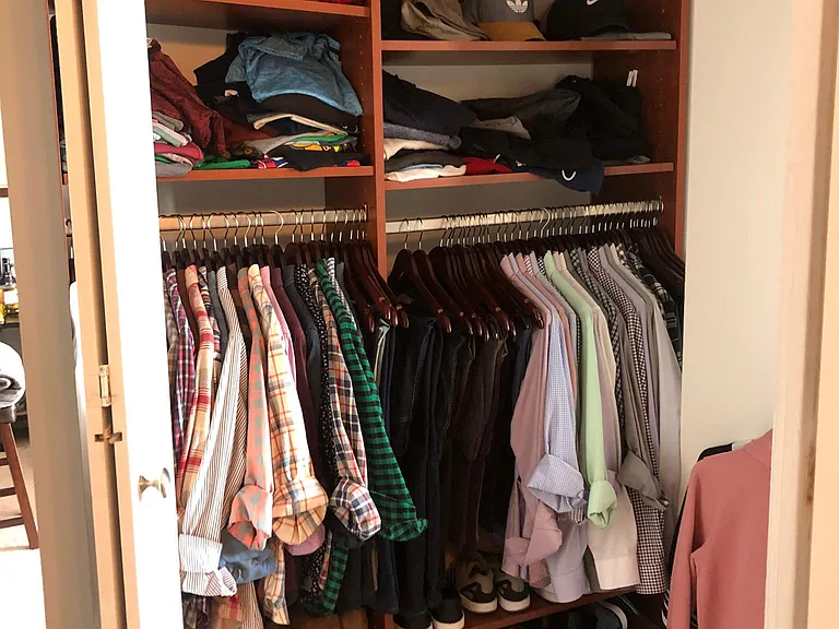 Master closet off bedroom hallway - across from bathroom