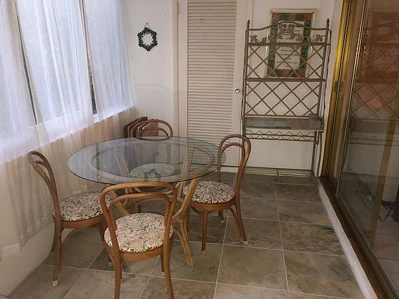 Eating area in sunroom and storage closet