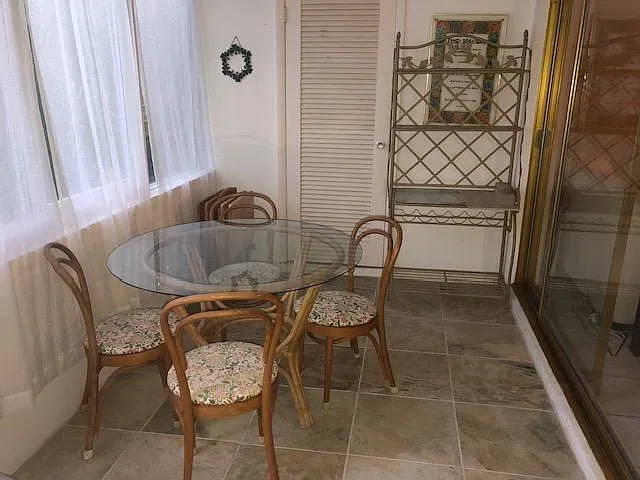 Eating area in sunroom and storage closet