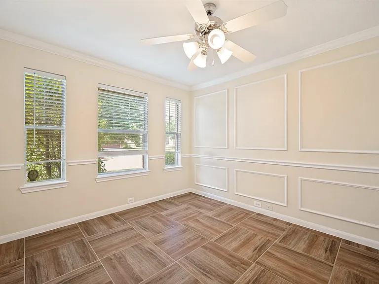 Located at front of the home; ceiling fan and natural light