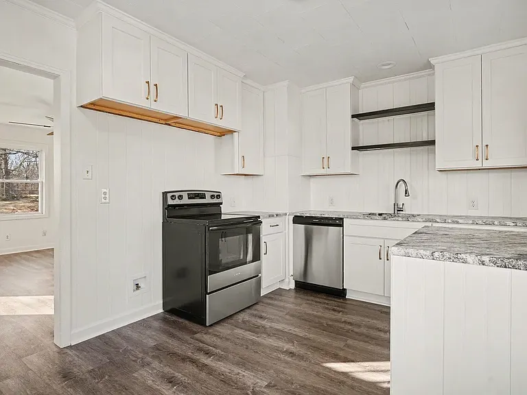 Kitchen- Refrigerator will be supplied. Everything is new! Cabinets, appliances and leathered granite countertops.