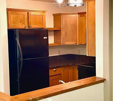 Kitchen opens to living room.