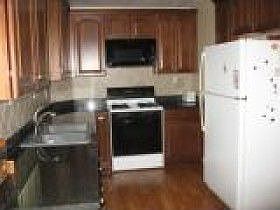 Kitchen, New Cherry cabinets, Granite counter tops, microwave & dishwasher. 