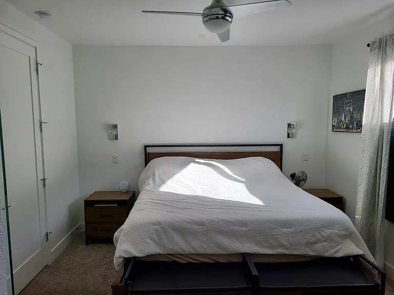 Primary bedroom with king size bed pictured