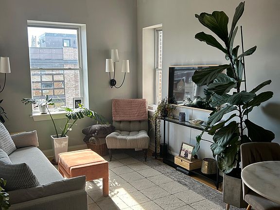 living room with super high ceilings (your plants will thrive!)