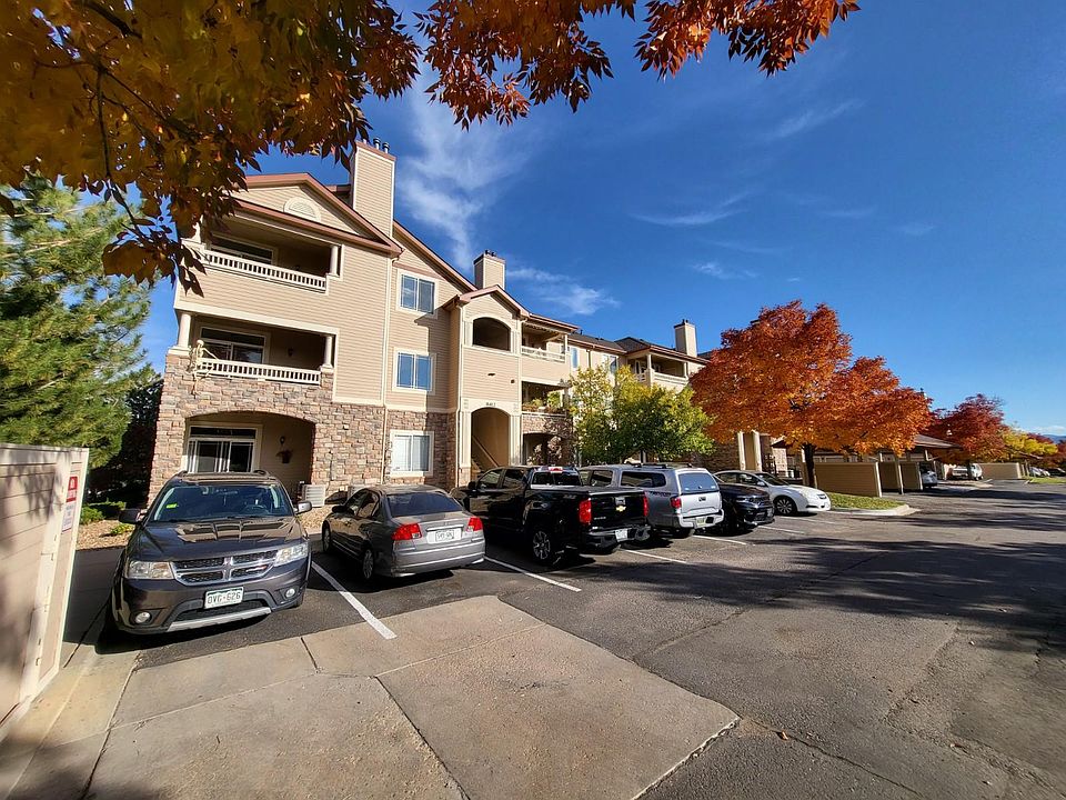 Front view of building entrance and unreserved parking