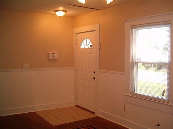 Front room, hardwood floors, ceramic tile at front door, secuity system