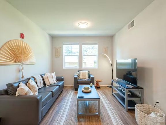 Welcome to your own personal oasis - the spacious and elegant living room of our suites. With comfortable furnishings, natural light and a cozy atmosphere, this living room is the perfect place to relax and unwind after a long day.