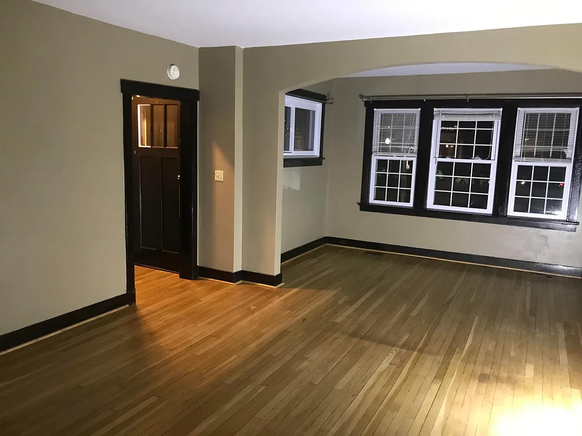 Living Room looking to front door and sun area (front of house) - 4807 Friendship Ave #1