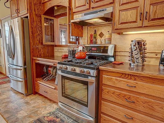 gorgeous cabinets, gas range electric in the pan cubby to store the microwave. Multiple cutting boards