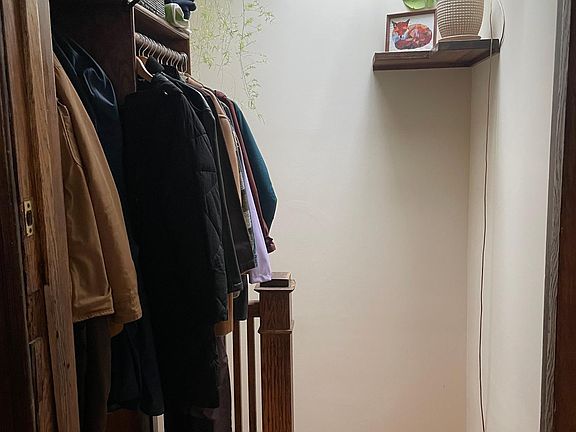 Entryway stairs with skylight & built-in closet