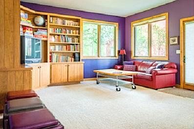 living room with built in bookcases, lots of light and privacy