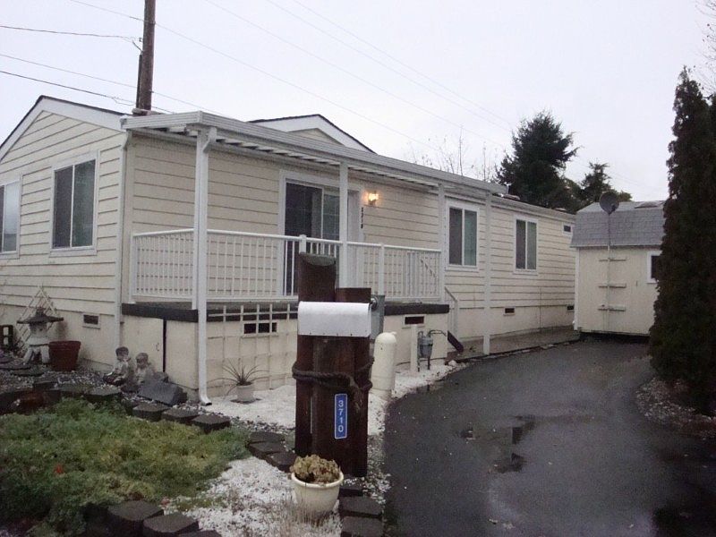 Nice quiet location in a cul-de-sac, not in between others that are in a row. Large shed on right plus a smaller one behind here is included in the sale.
