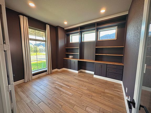 double door office with custom built ins