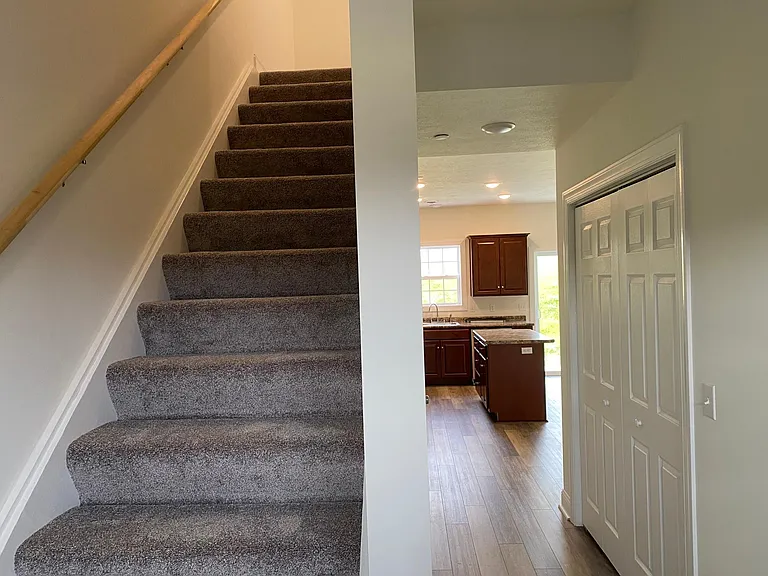 Hallway to 3 bedrooms upstairs