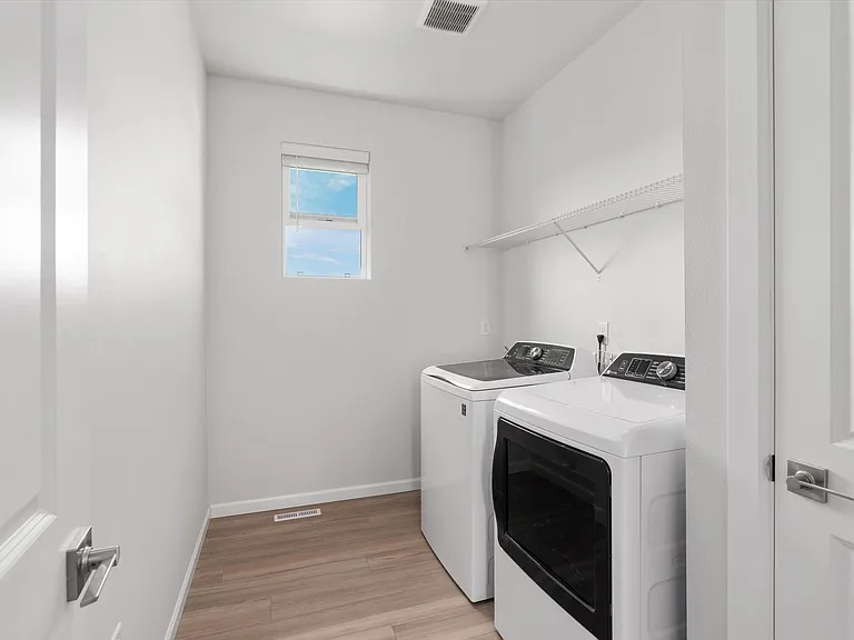 Laundry Room with Linen Closet & Sink
