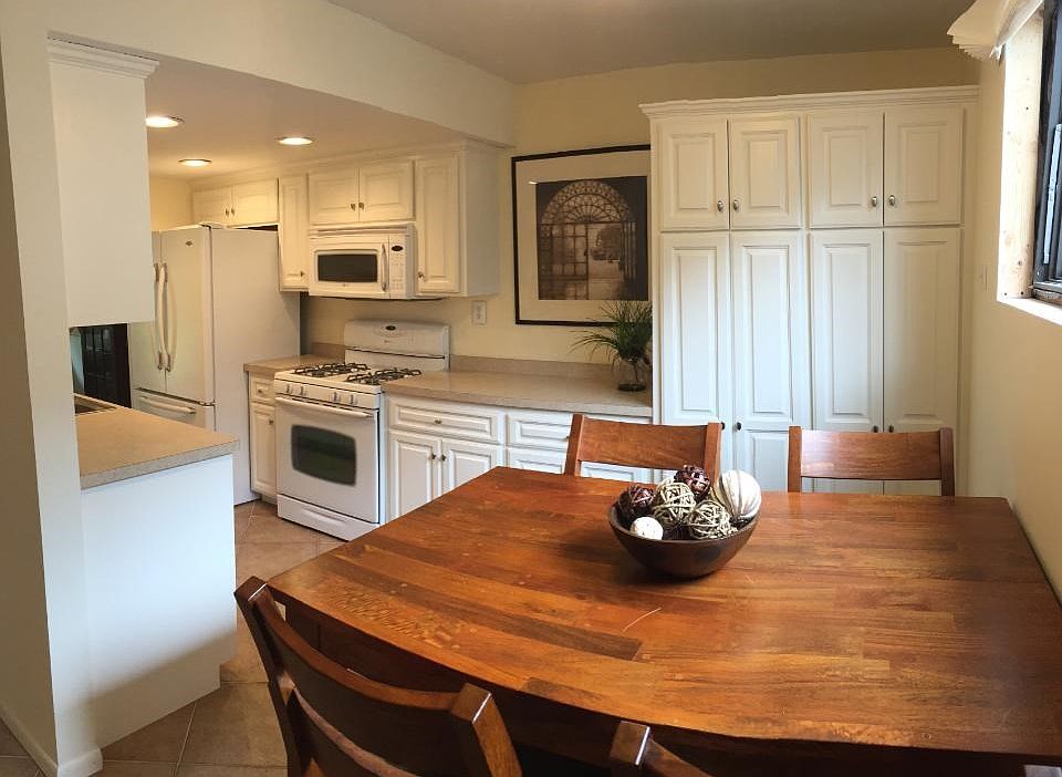 A must see!  Tastefully updated kitchen with white finished and tile floors!