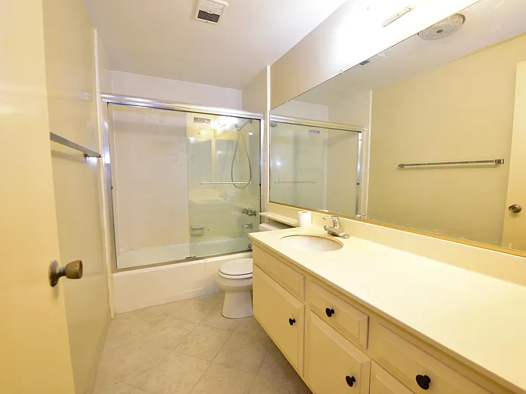 Large updated bathroom with all-in-one laundry machine