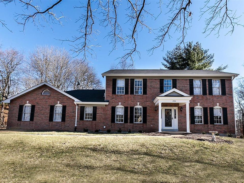 Stately 4 bedroom, 3 1/2 bath 2 story with over 3800 sq. feet of living space, located in Winding Trails subdivision in desirabl