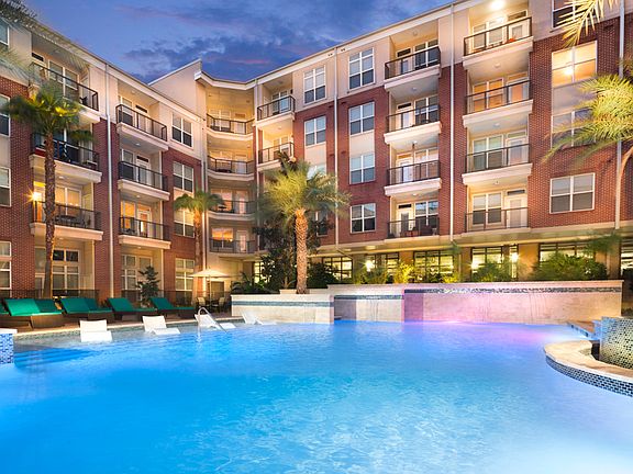 Resort-style swimming pool with tanning shelves