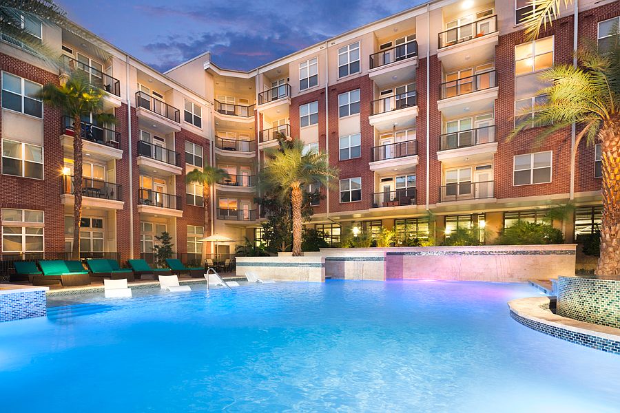 Resort-style swimming pool with tanning shelves