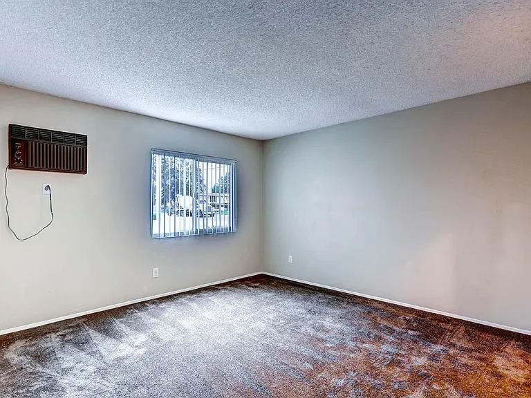 A Classic Primary Bedroom at Midway Gardens Apartments
