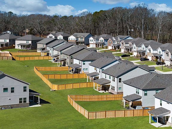 Aerial view highlighting the beautiful exteriors of Baxter Woods Homes.
