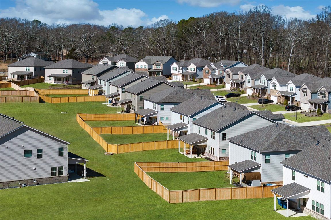 Aerial view highlighting the beautiful exteriors of Baxter Woods Homes.
